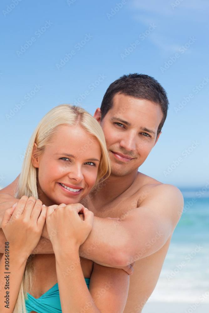 Enamored couple on the beach