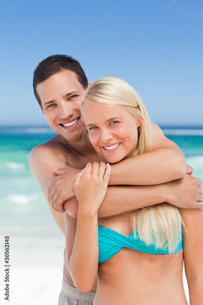 Enamored couple on the beach