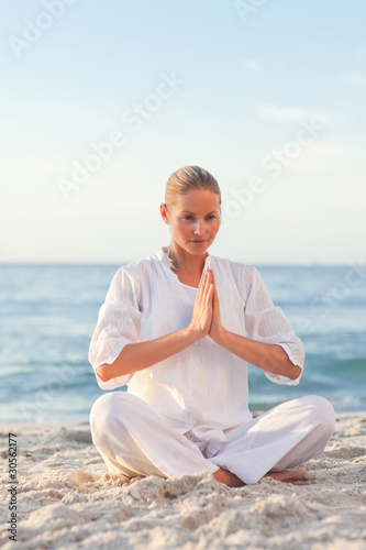 Peaceful woman practicing yoga © WavebreakMediaMicro