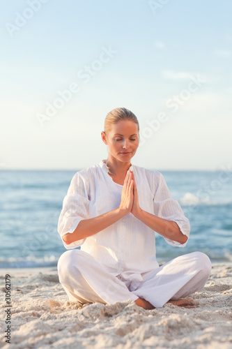 Peaceful woman practicing yoga