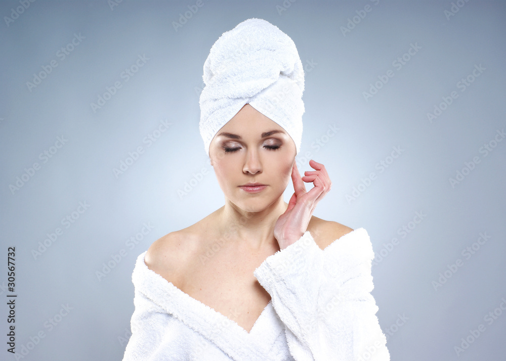 A young and sexy Caucasian woman is pampering her face A young and sexy Caucasian woman is pampering her face