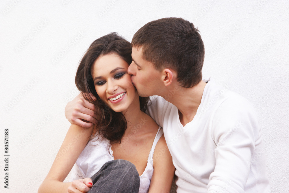 A young and loving Caucasian couple is embracing each other A young and loving Caucasian couple is embracing each other