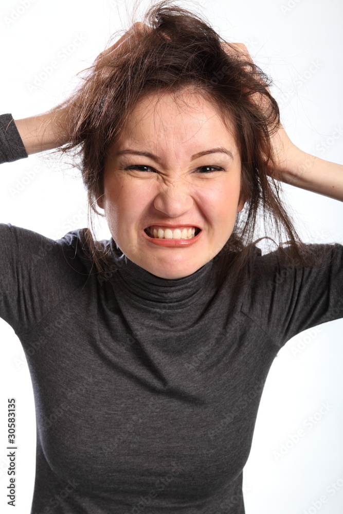 Frustration pretty young woman tearing out hair Frustration pretty young woman tearing out hair