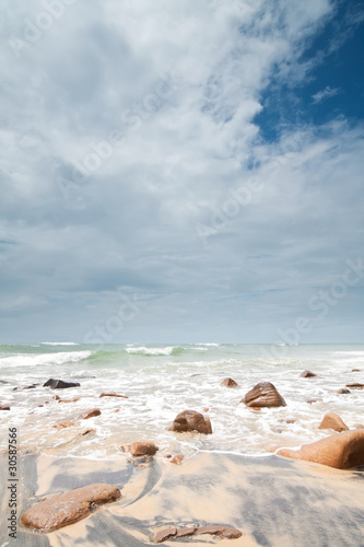 Fototapeta Naklejka Na Ścianę i Meble -  big clouds over rocks on the beach