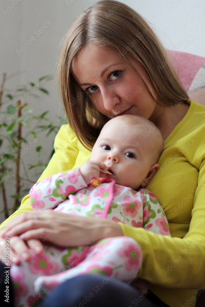Adorable baby and mother in home Adorable baby and mother in home