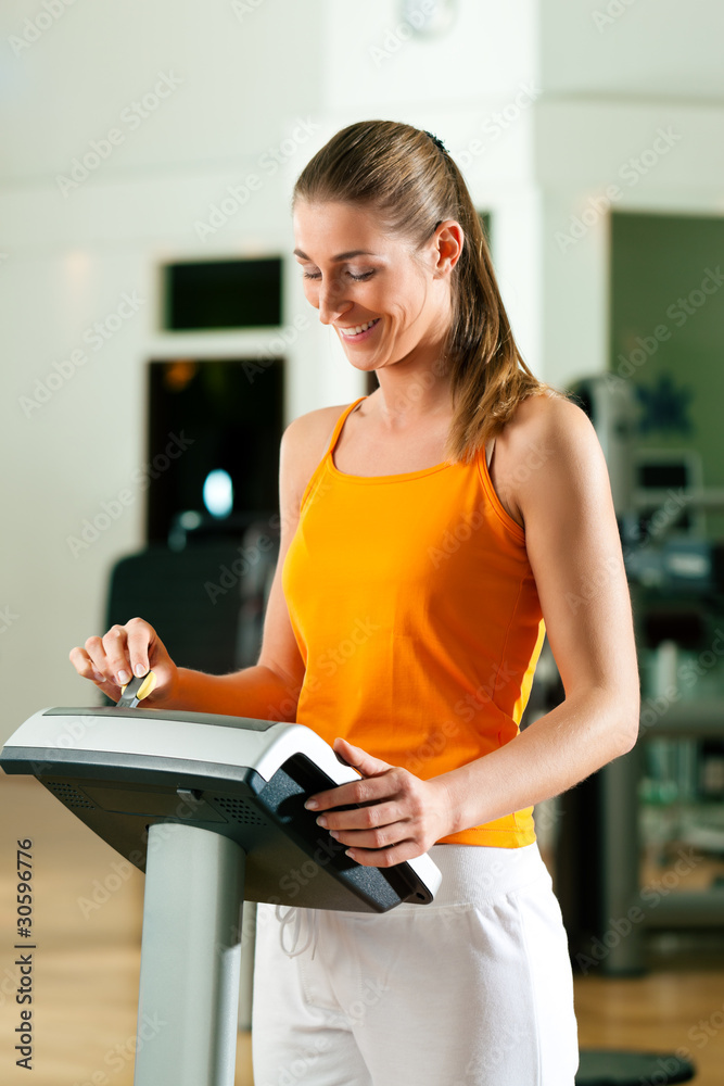 Fototapeta premium Woman exercising with modern key system