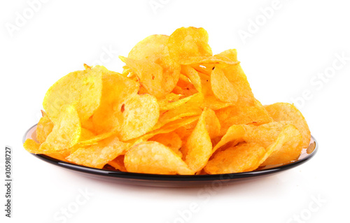 potato crisps on the plate isolated on white