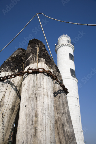 Venice - wood column and light-house from Murano photo