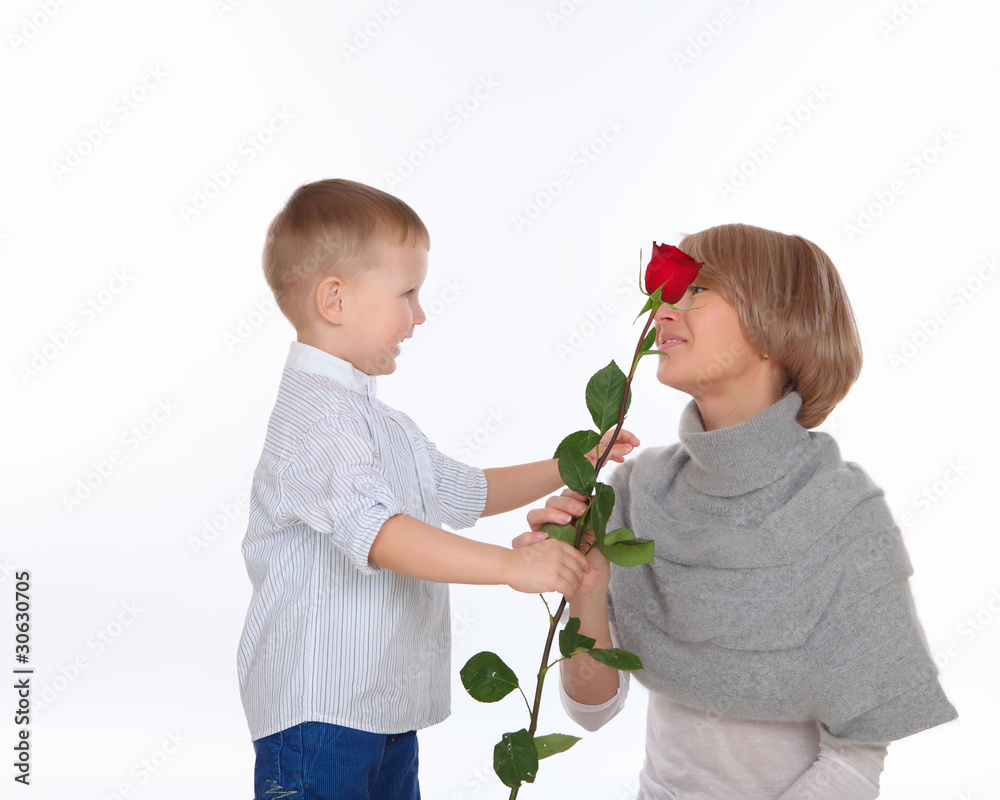 mother and son holding a red rose mother and son holding a red rose