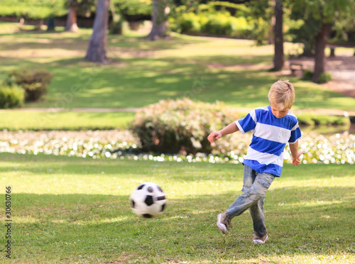 Boy playing football in the park © WavebreakMediaMicro