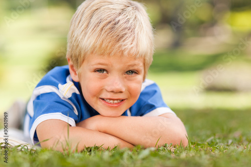 Boy lying down in the park