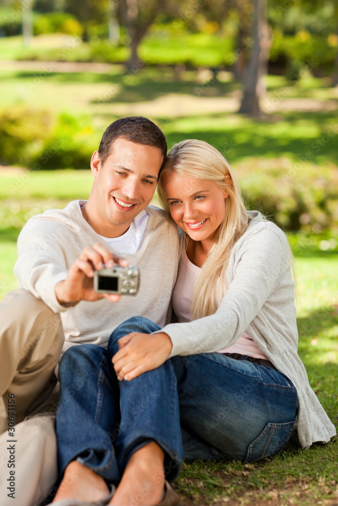 Young couple taking a photo of themselves Young couple taking a photo of themselves