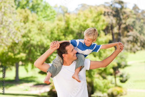 Man giving son a piggyback