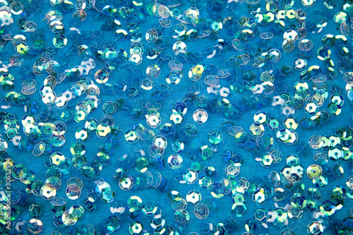 Bright spangles on a blue celebratory fabric