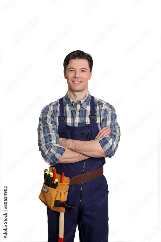 Carpenter standing on white background with arms crossed Carpenter standing on white background with arms crossed
