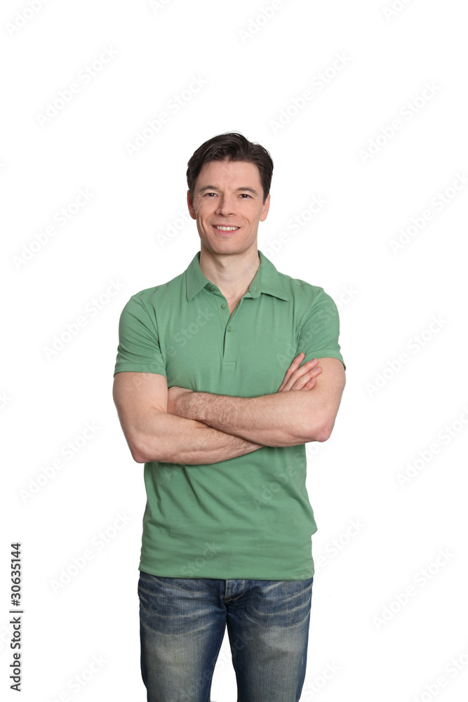 Fototapeta premium Adult man with green shirt standing on white background