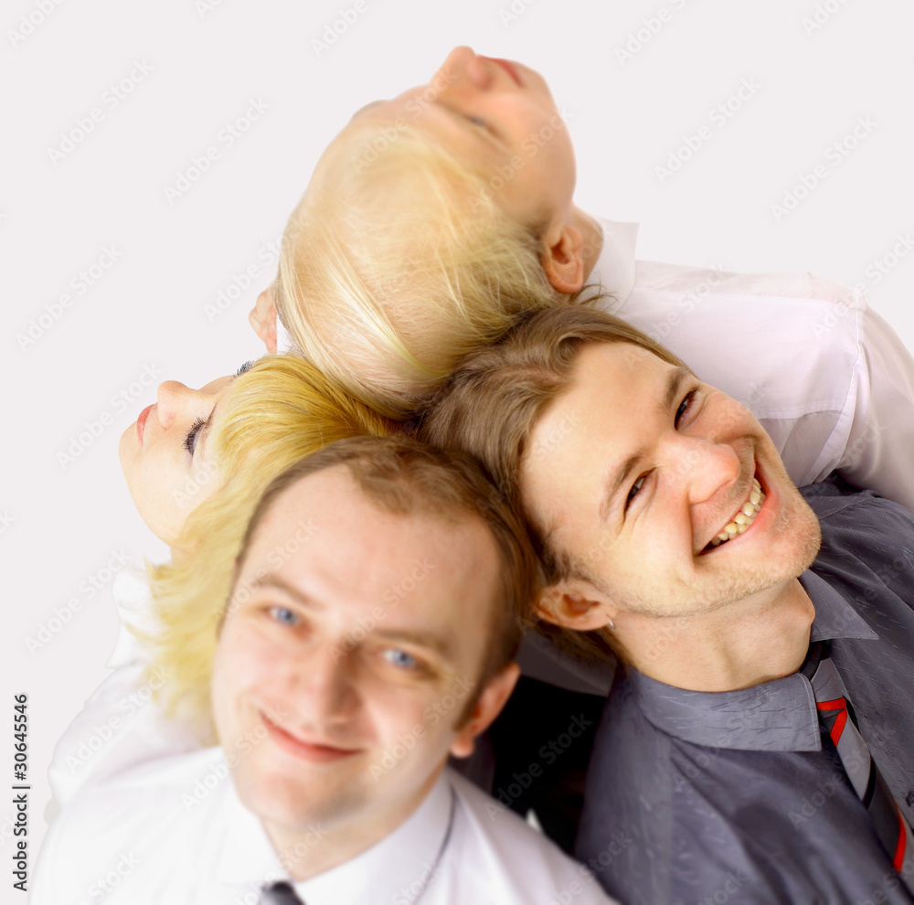 A team of happy business people looking upwards at