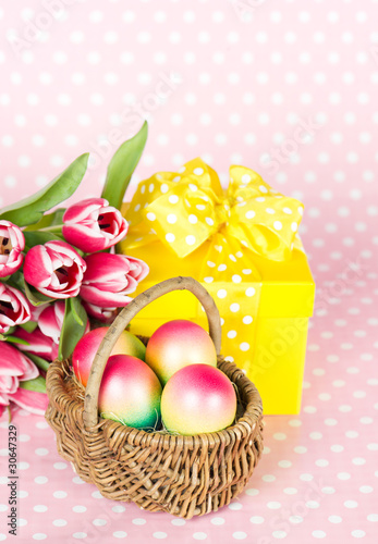 Pink tulips, easter eggs and gift box