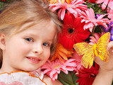 Cute child lying on the flower.