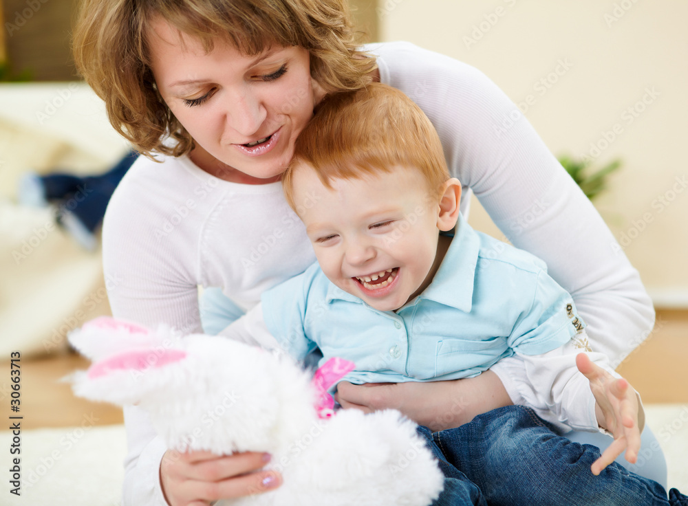 mother and son at home on the floor mother and son at home on the floor