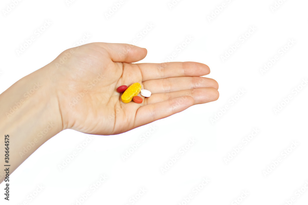 Woman hand holding supplements Woman hand holding supplements