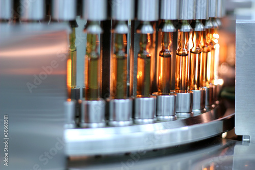 Pharmaceutical Automatic Inspection Machine - Ampoules. Inspects Vials and Ampules for Particulates in Liquid and Container Defects. Pharmaceutical Manufacturing. Vaccine Manufacturing.