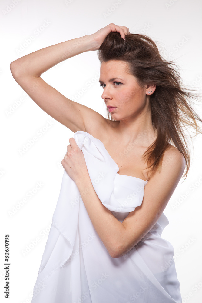 Attractive woman covered in white cloth on white Attractive woman covered in white cloth on white