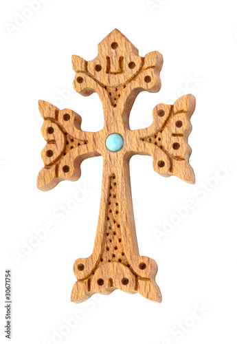 carved wooden cross decorated with turquoise bead
