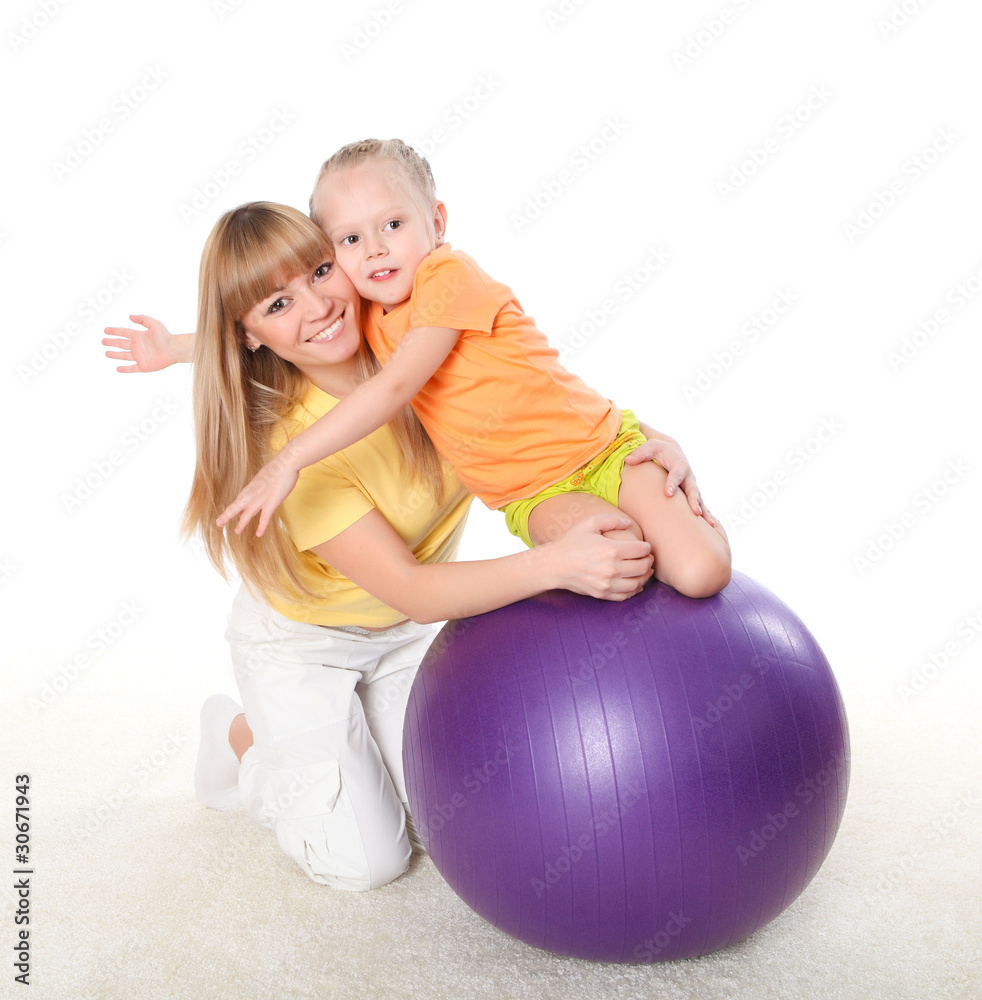 mother and little daughter doing sport together mother and little daughter doing sport together