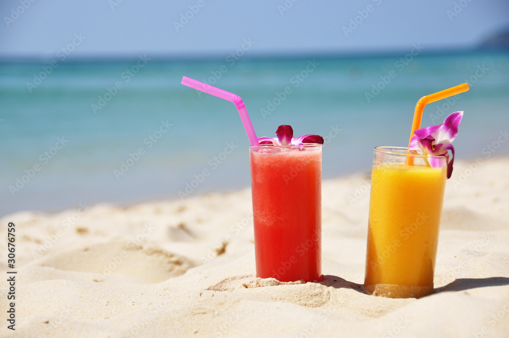 Pair of fruit shakes on the tropical beach