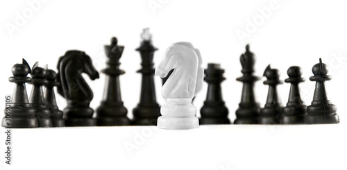 chess isolated. one white knight in front of black chess