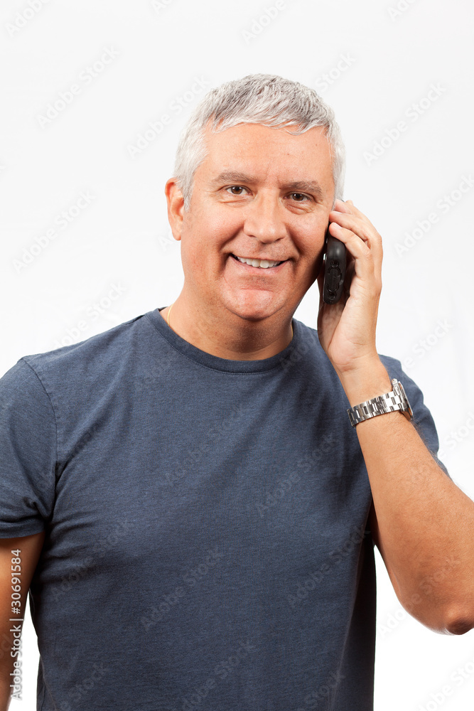 Middle Age Man Speaking on a Cell Phone Middle Age Man Speaking on a Cell Phone