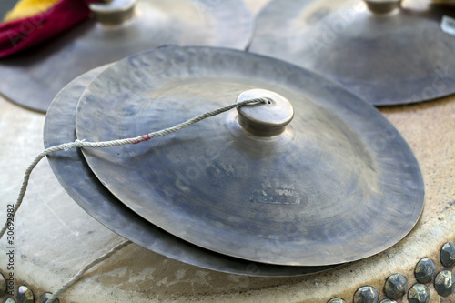 Chinese cymbals sitting on top of drum