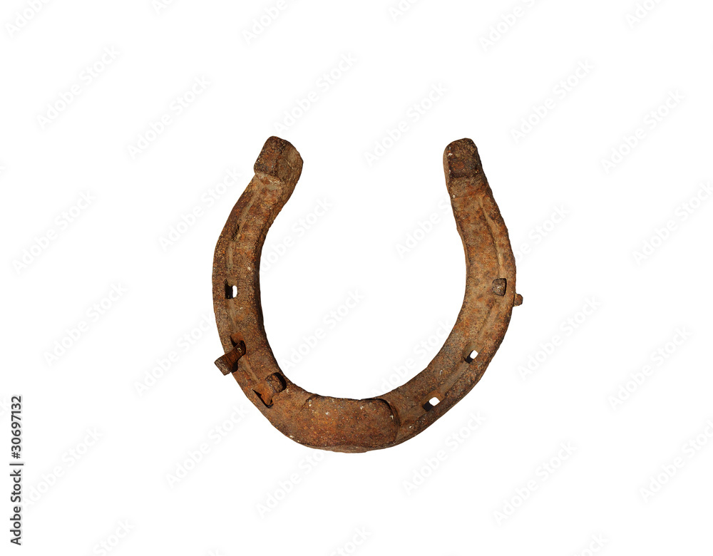 Old rusty horseshoe with nail isolated on white background