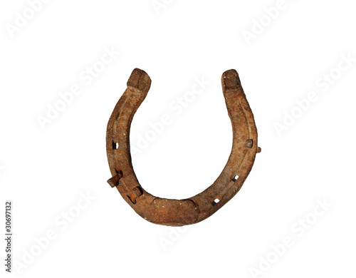 Old rusty horseshoe with nail isolated on white background