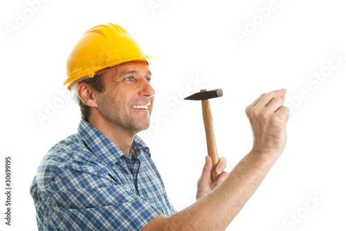 Fotografie, Obraz Confident worker hammering in