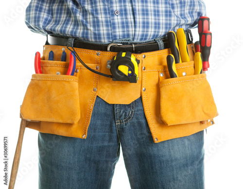 Close-up on worker's toolbelt photo