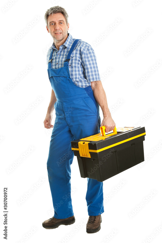 Confident service man with toolbox Stock Photo | Adobe Stock