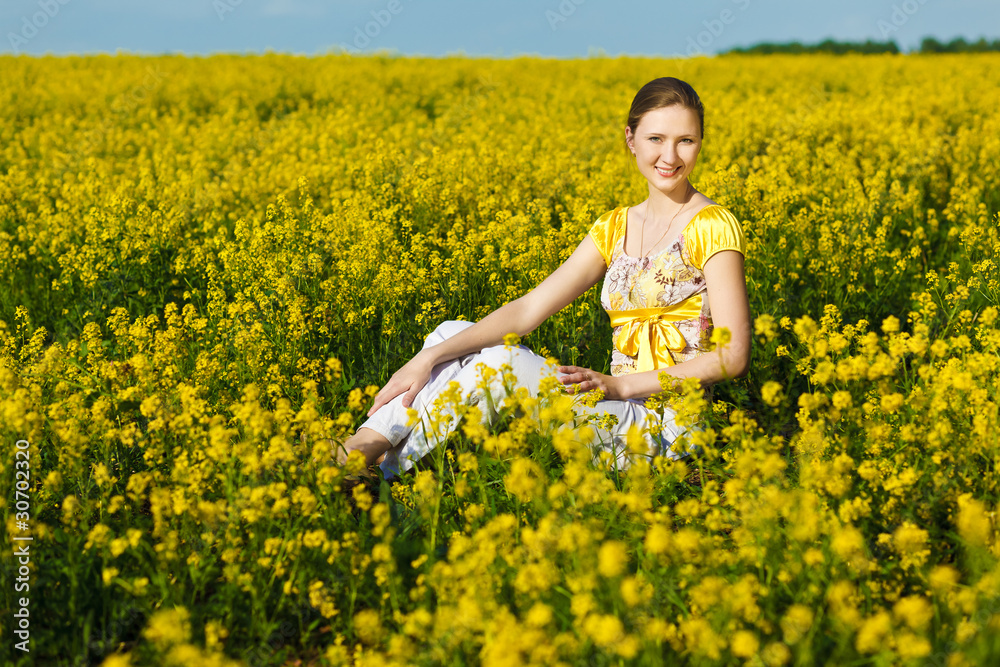 Fototapeta premium happy woman on yellow field