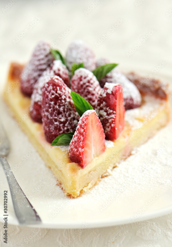 Piece of white chocolate and strawberry tart
