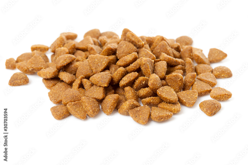 Pile of dry cat food over white background Pile of dry cat food over white background