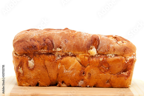 baked sugar bread in closeup on cutting board photo