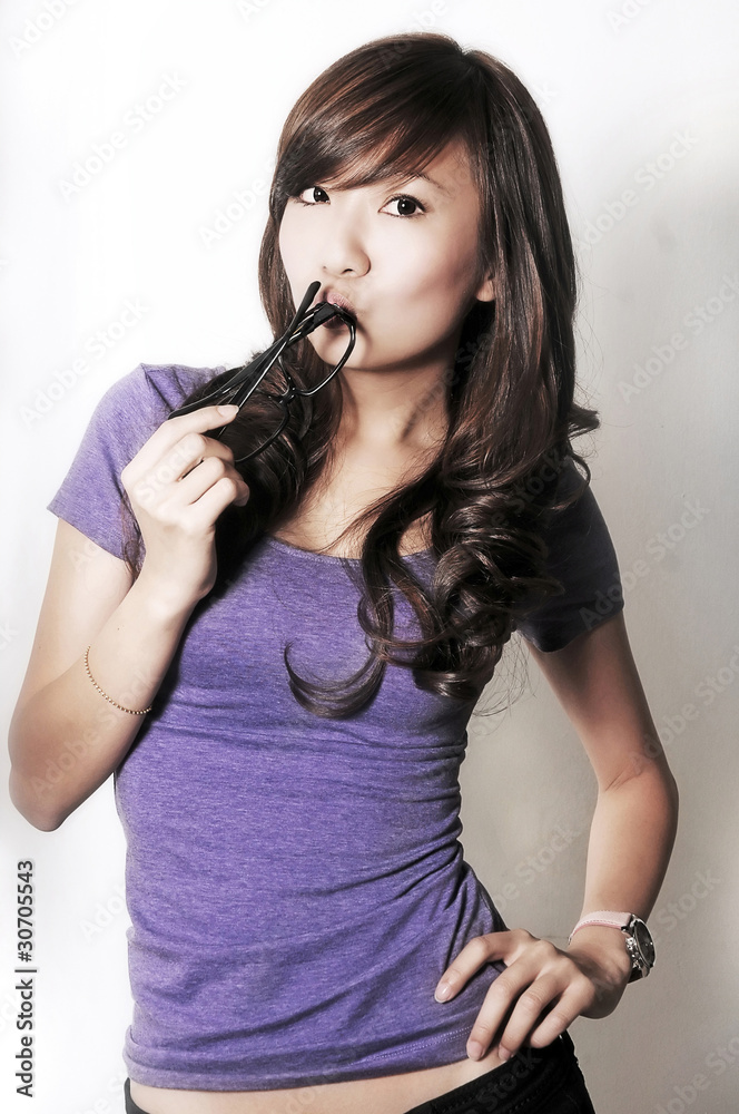 Beautiful Asian Chinese model posing with glasses Beautiful Asian Chinese model posing with glasses