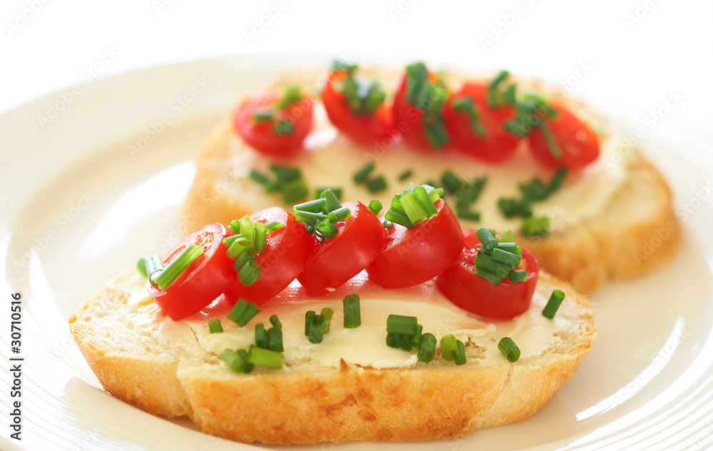 Tasty sandwich with cream cheese and tomatoes
