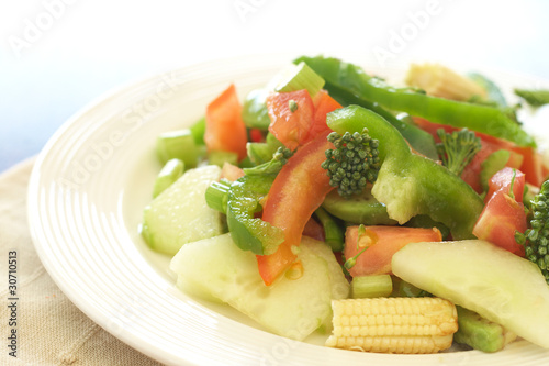 Fresh salad with cucumber, tomato and peppers