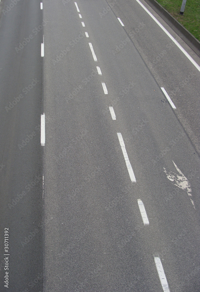 triple highway with grass border on the right triple highway with grass border on the right