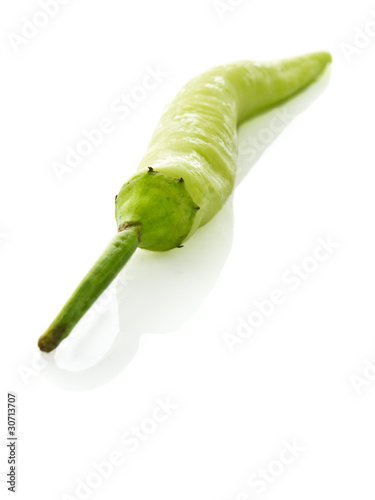 Green chilly on white background
