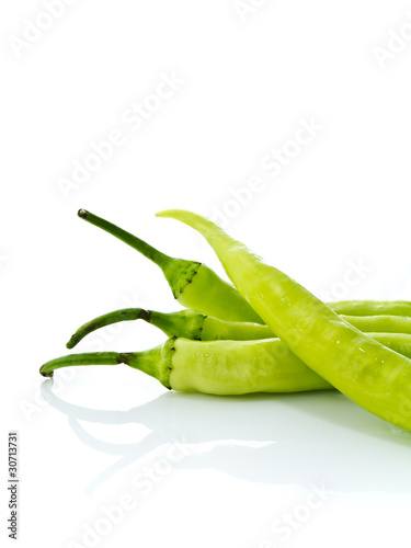 Green chilly on white background