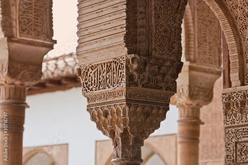 Stonework on the columns of Alhambra photo