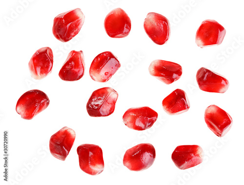 Pomegranate fruit seeds isolated on white macro background